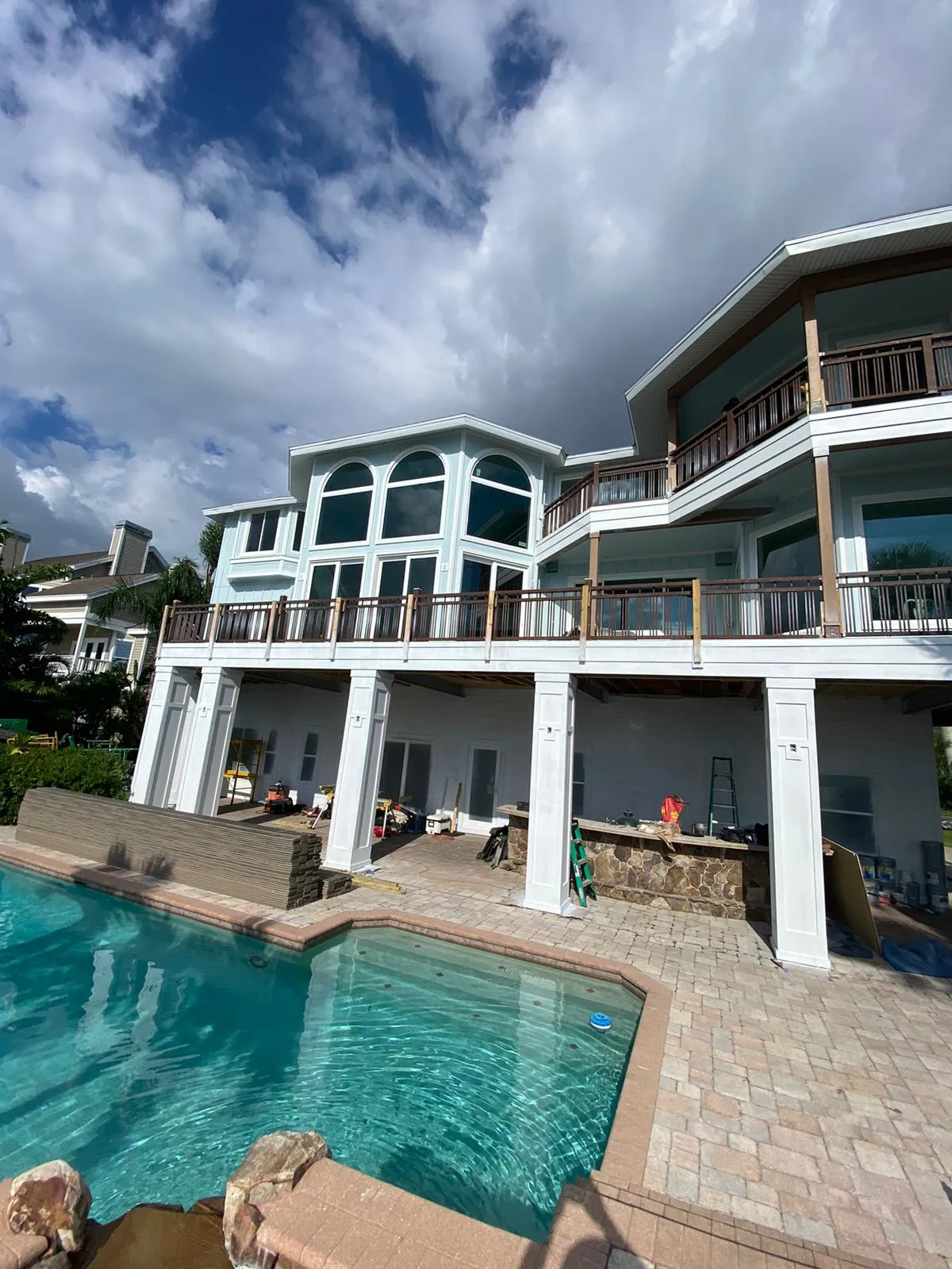 Balcony and window trim painting on elevated waterfront property