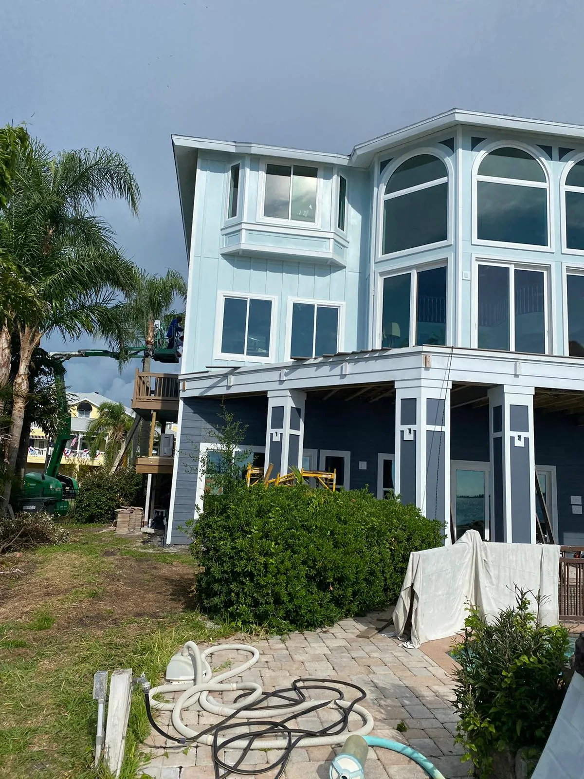 Coastal home wide-angle view showing complete exterior paint job