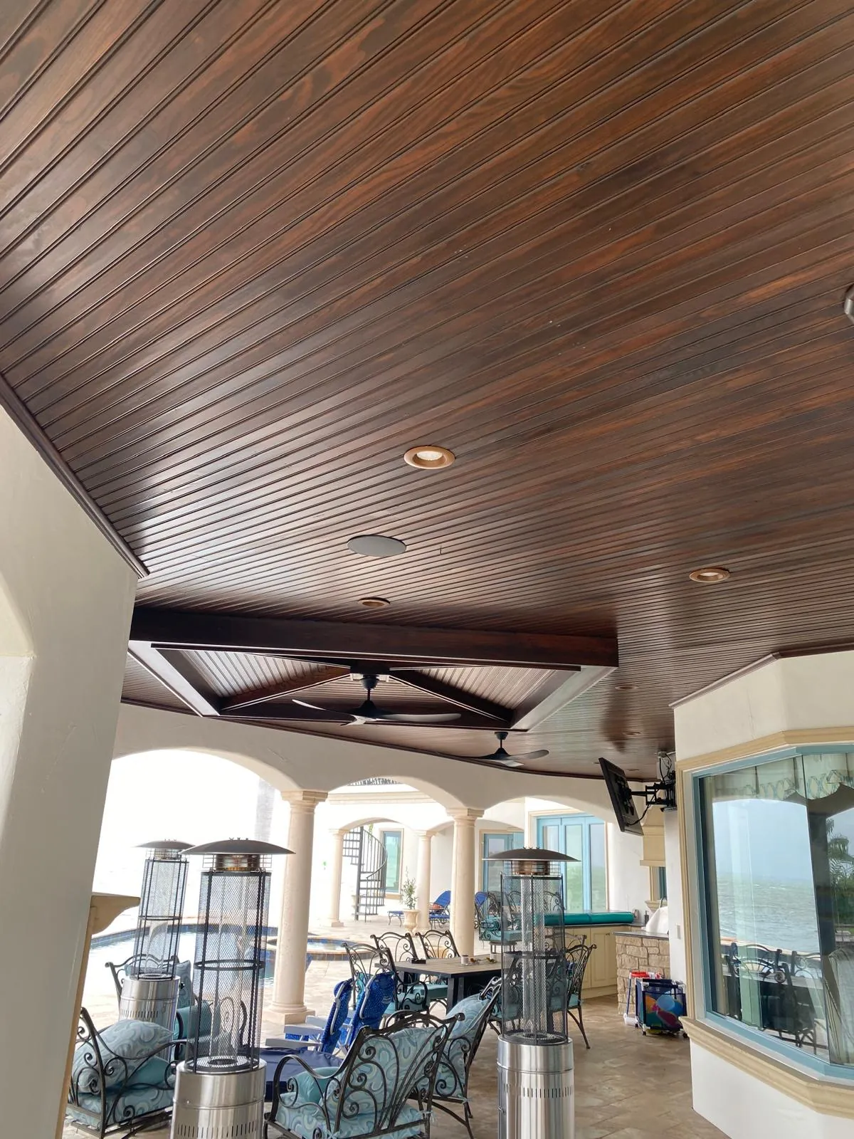 Wood ceiling beam staining in upscale residence